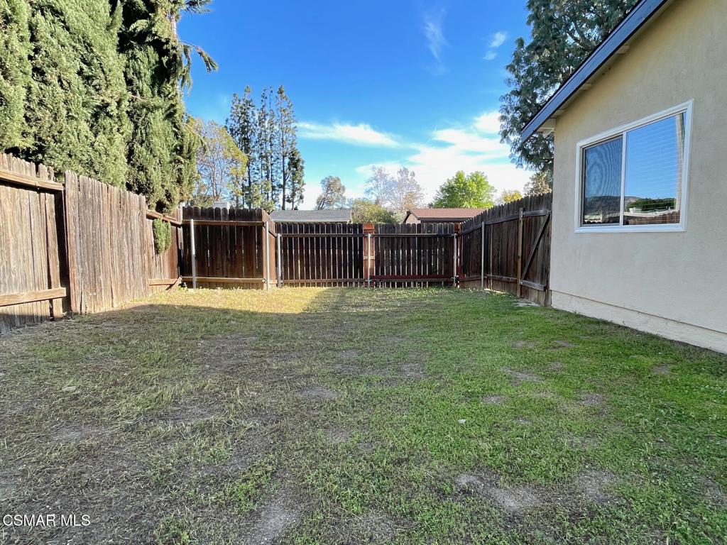 4881 Muirwood Court Simi Valley, CA 93063 - Photo 25 of 32 a view of a house with backyard and a tree