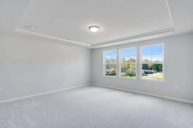 an empty room with windows and view