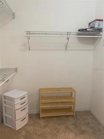 a view of room with racks on the wall