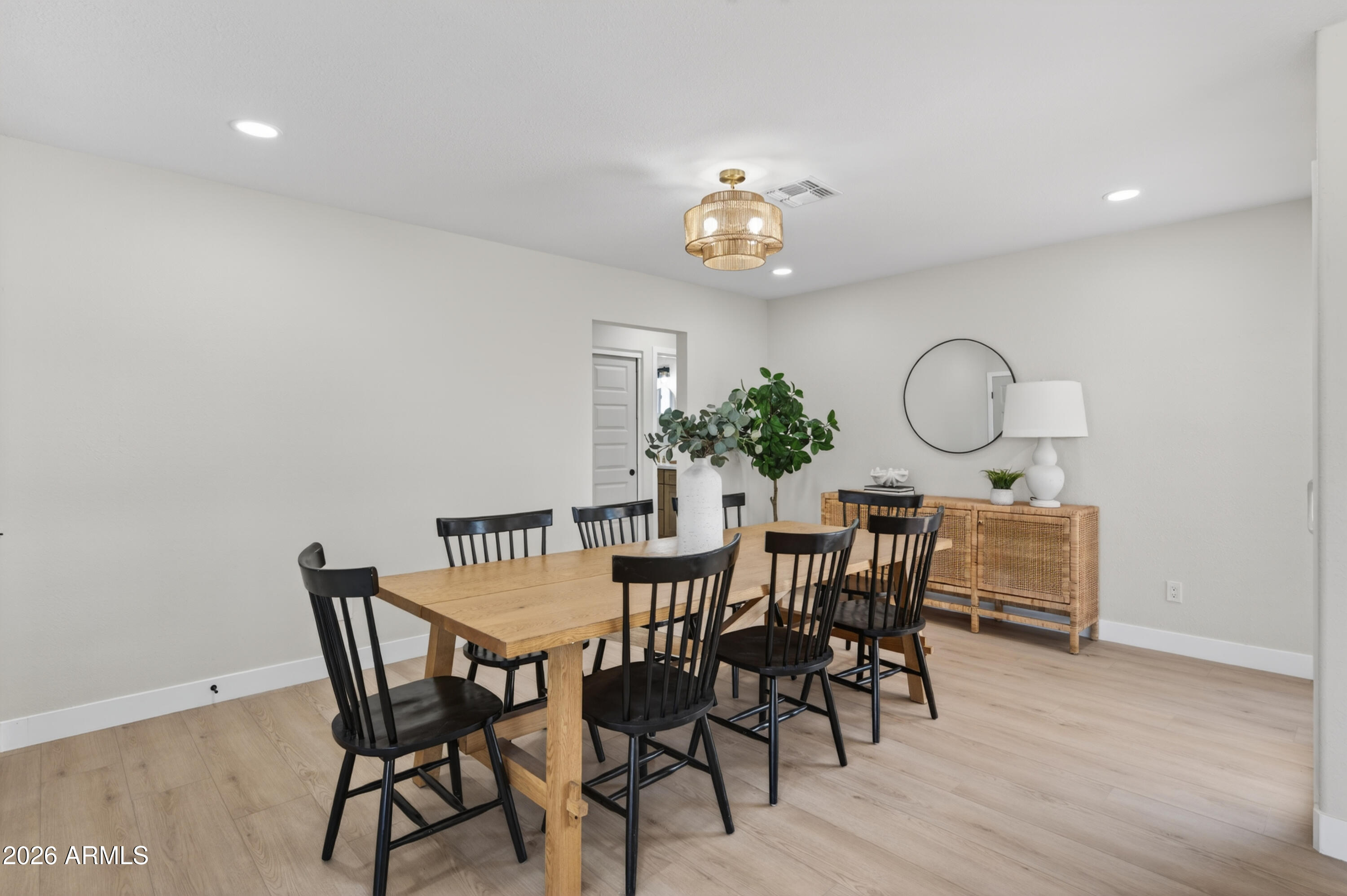 3422 South Terrace Road Tempe, AZ 85282 - Photo 15 of 43 a view of a dining room with furniture and wooden floor