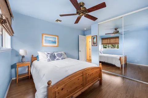 a bedroom with a bed and a couch