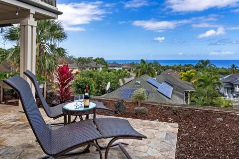 a view of a chairs and table in patio