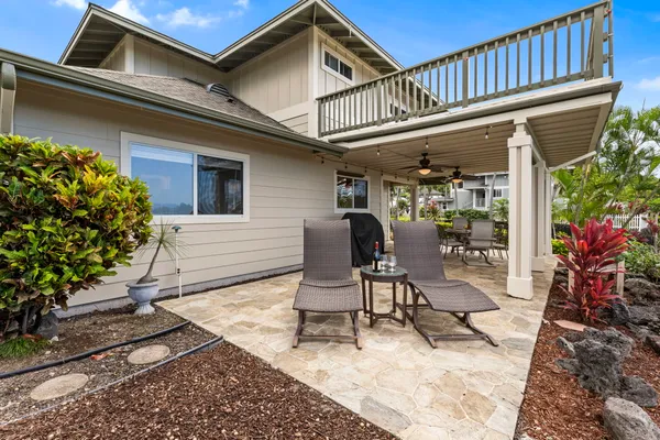 a view of a chairs and table in a patio