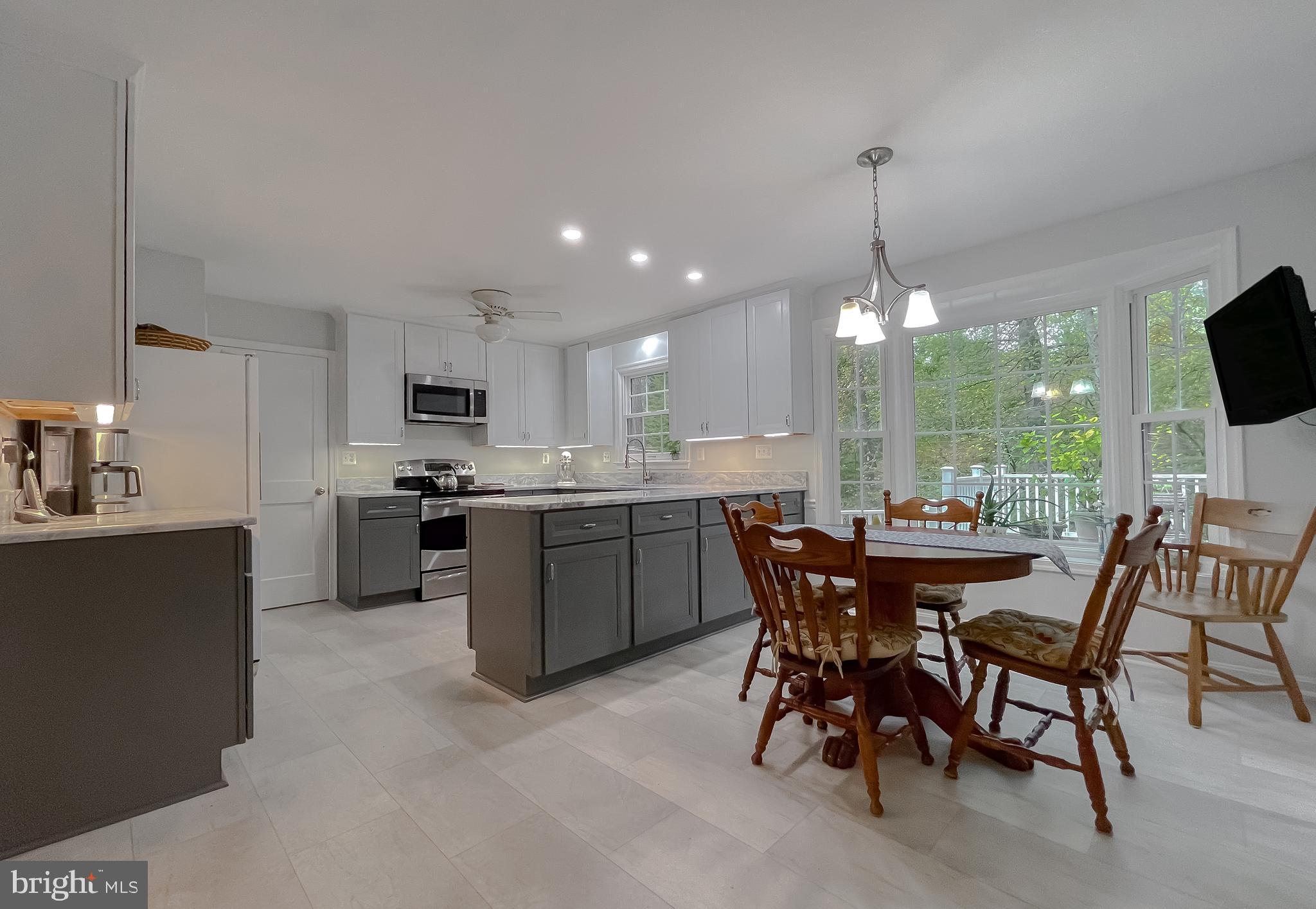 513 Clarks Run Road La Plata, MD 20646 - Photo 12 of 35 a kitchen with a table and chairs in it