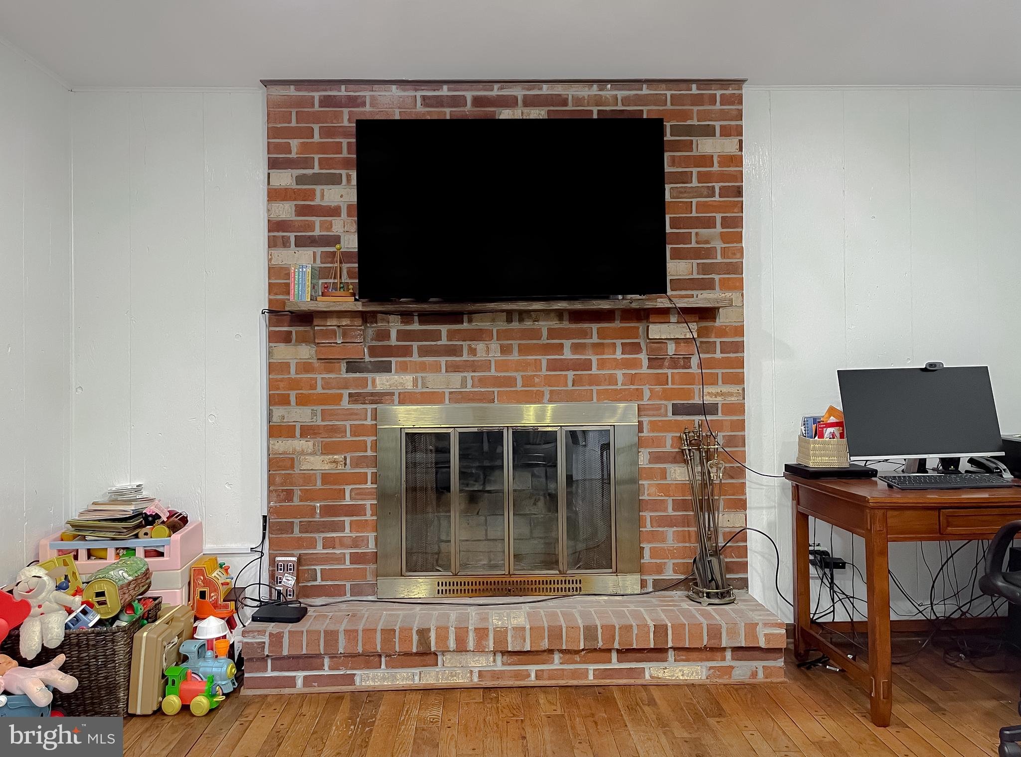 513 Clarks Run Road La Plata, MD 20646 - Photo 15 of 35 a living room with a fireplace and a flat screen tv