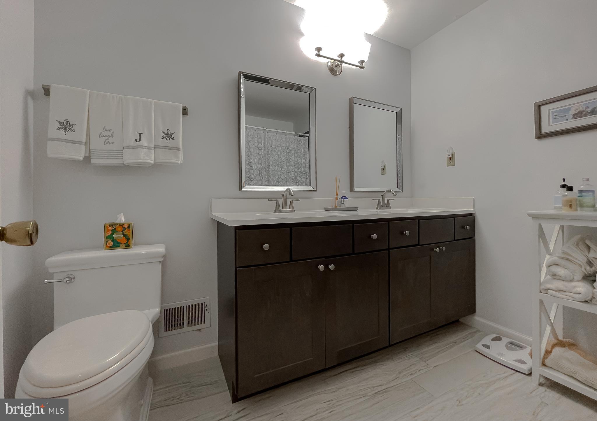 513 Clarks Run Road La Plata, MD 20646 - Photo 18 of 35 a bathroom with a toilet a sink and mirror