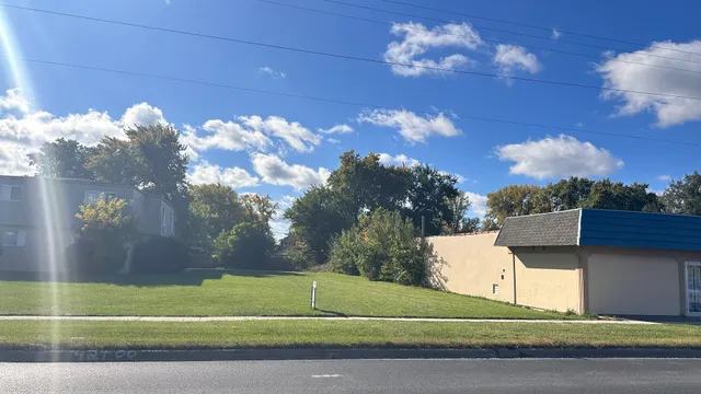 a view of a building and a yard