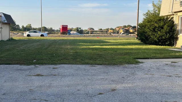 a backyard with grassy field