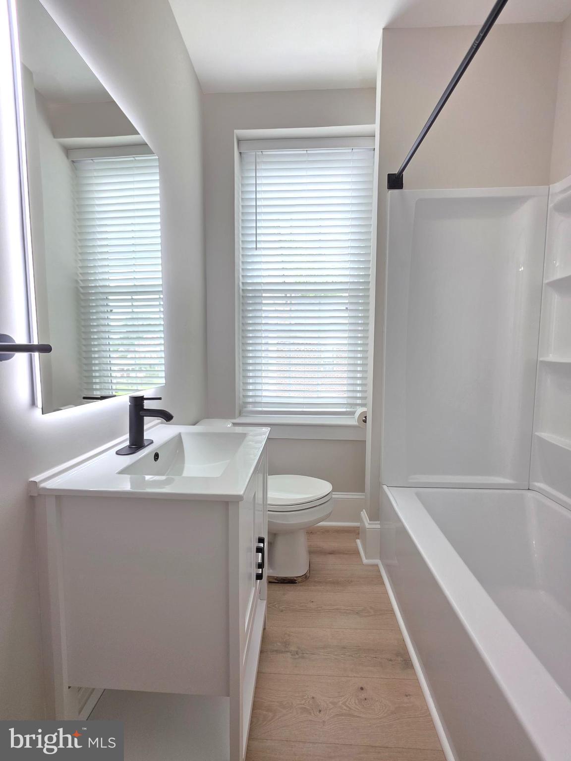 9 East Reliance Road Souderton, PA 18964 - Photo 11 of 16 a bathroom with a granite countertop sink a toilet and tub