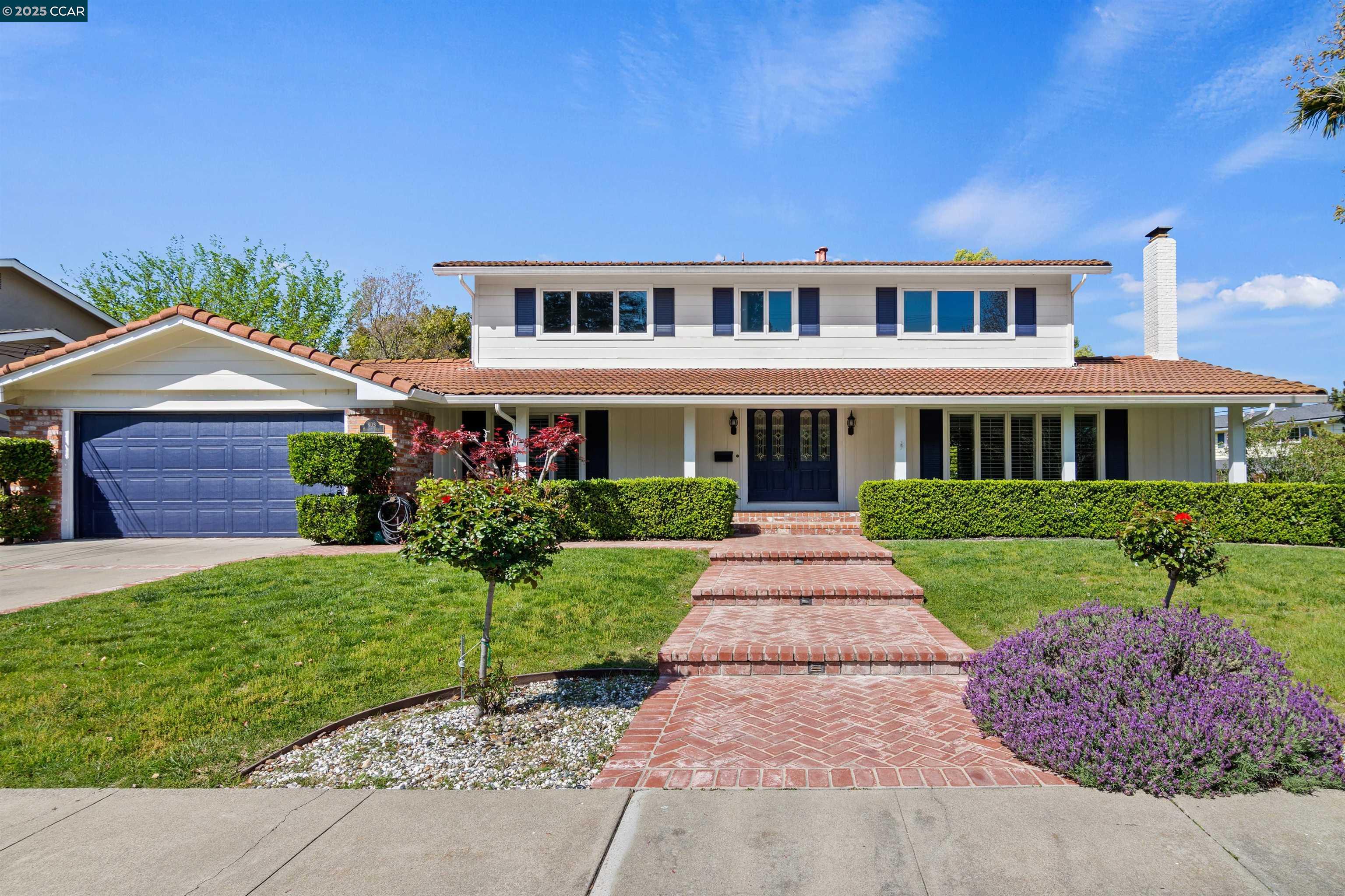 front view of a house with a yard