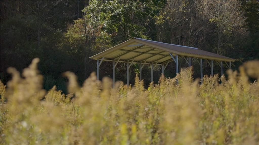 0 Flat Rock Road Avonmore, PA 15618 - Photo 16 of 27 a backyard of a house with table and chairs