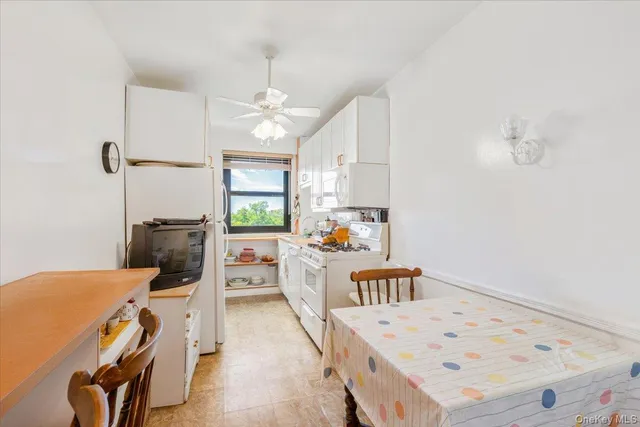 a living room with furniture a window and appliances