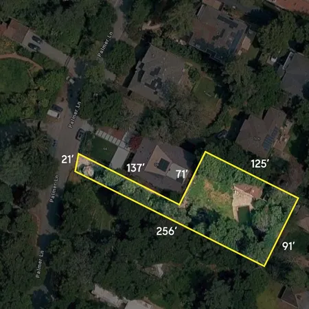 an aerial view of house with yard