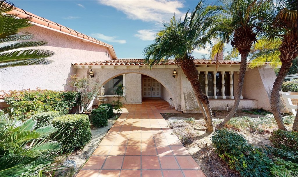23712 Ridge Line Road Diamond Bar, CA 91765 - Photo 1 of 1 a view of a house with a yard and potted plants
