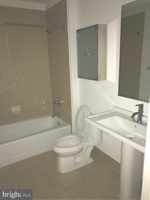 2125 14th Street Northwest, Unit 527 Washington, DC 20009 - Photo 15 of 20 a bathroom with a sink a toilet and bathtub