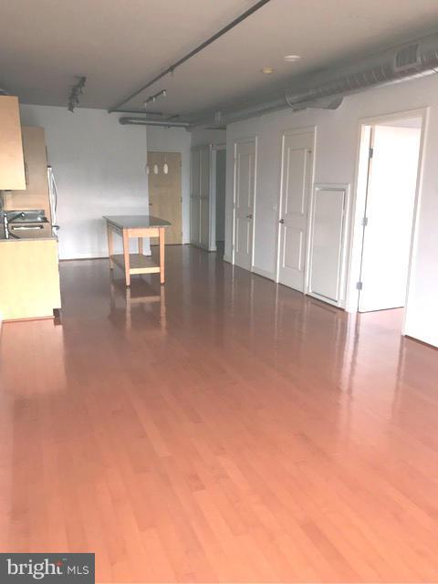2125 14th Street Northwest, Unit 527 Washington, DC 20009 - Photo 8 of 20 a view of kitchen with furniture and wooden floor