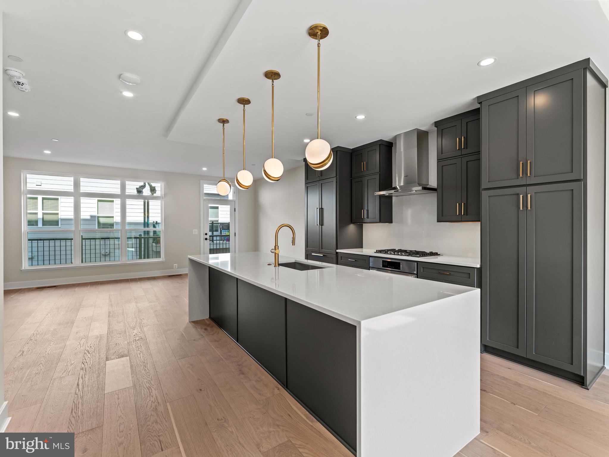 2015 Tysons Ridgeline Road Falls Church, VA 22043 - Photo 12 of 33 a large kitchen with kitchen island a sink stainless steel appliances and cabinets