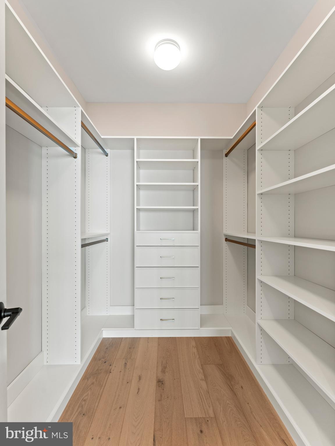 2015 Tysons Ridgeline Road Falls Church, VA 22043 - Photo 21 of 33 a view of walk in closet with empty racks
