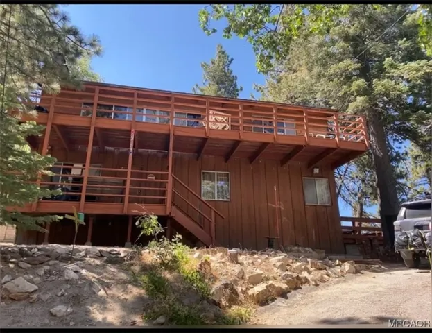 a view of a backyard with a large tree