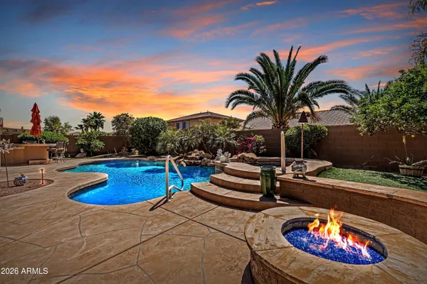 a view of swimming pool with outdoor seating
