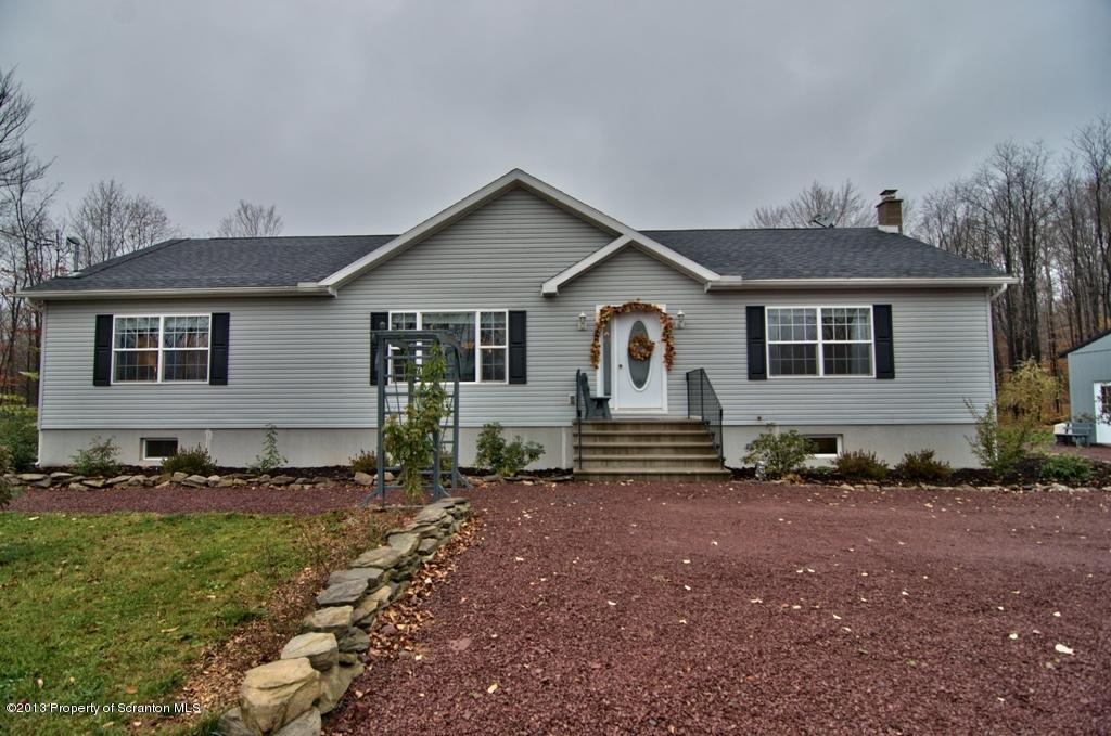 1633 Howe Road Moscow, PA 18444 - Photo 1 of 59 a front view of a house with a yard