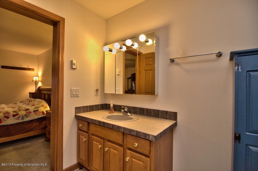 1633 Howe Road Moscow, PA 18444 - Photo 13 of 59 a bathroom with a sink and a mirror