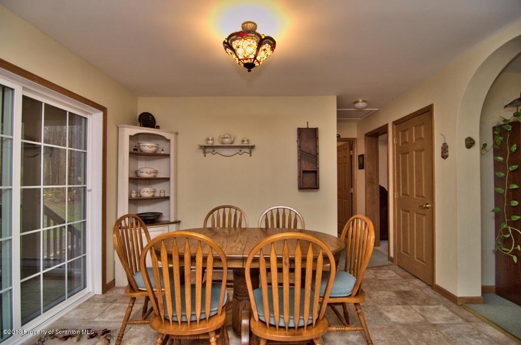 1633 Howe Road Moscow, PA 18444 - Photo 31 of 59 a view of a dining room with furniture window and wooden floor