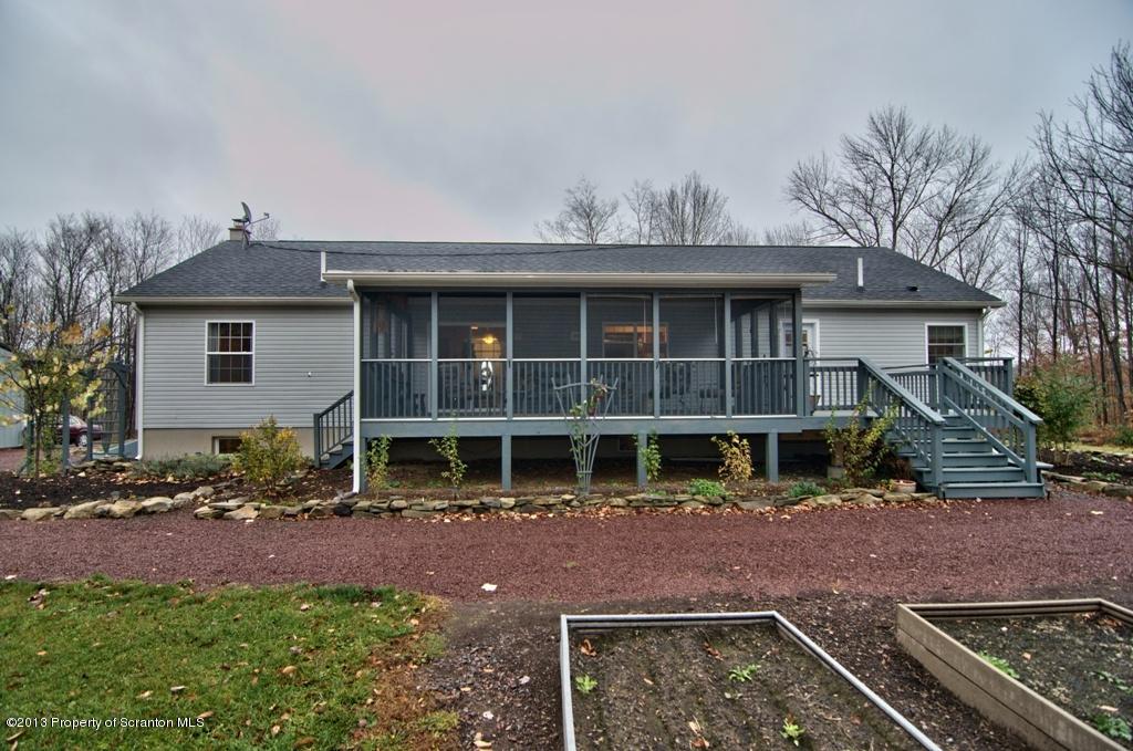 1633 Howe Road Moscow, PA 18444 - Photo 36 of 59 a front view of a house with a yard
