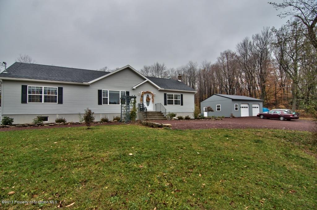1633 Howe Road Moscow, PA 18444 - Photo 39 of 59 a front view of house with yard and trees