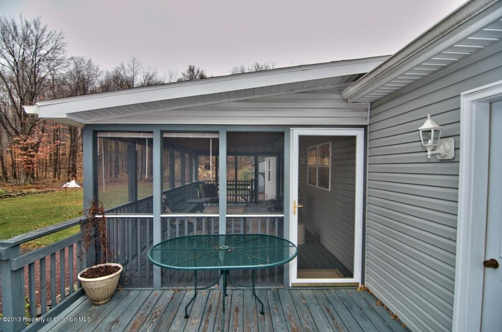 1633 Howe Road Moscow, PA 18444 - Photo 4 of 59 a view of a wooden floor and a table