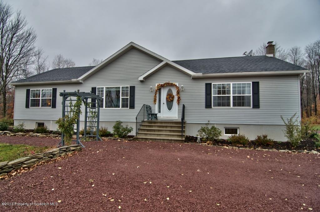 1633 Howe Road Moscow, PA 18444 - Photo 42 of 59 a front view of a house with a yard