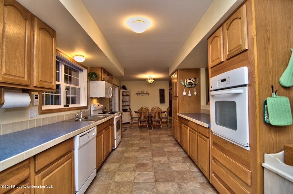 1633 Howe Road Moscow, PA 18444 - Photo 50 of 59 a large kitchen with stainless steel appliances granite countertop lots of counter top space