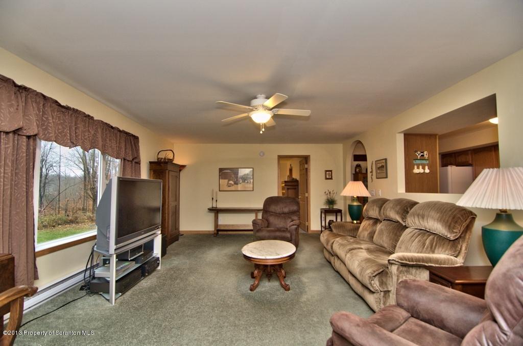 1633 Howe Road Moscow, PA 18444 - Photo 55 of 59 a living room with furniture and a large window