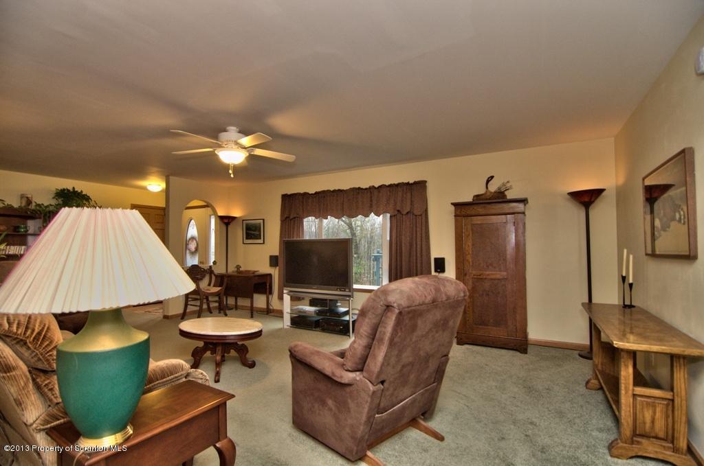 1633 Howe Road Moscow, PA 18444 - Photo 59 of 59 a living room with furniture and a flat screen tv