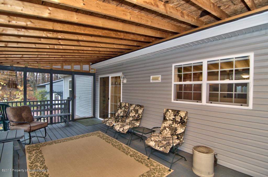 1633 Howe Road Moscow, PA 18444 - Photo 6 of 59 a front view of a house with outdoor seating