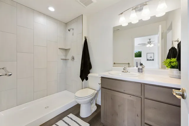 a bathroom with a sink toilet and shower