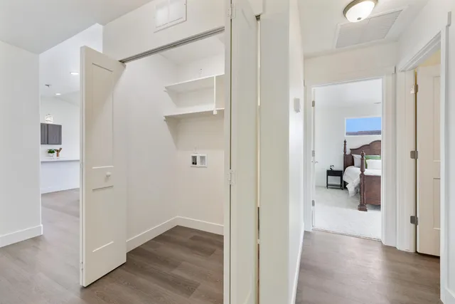 a view of a bedroom from a hallway