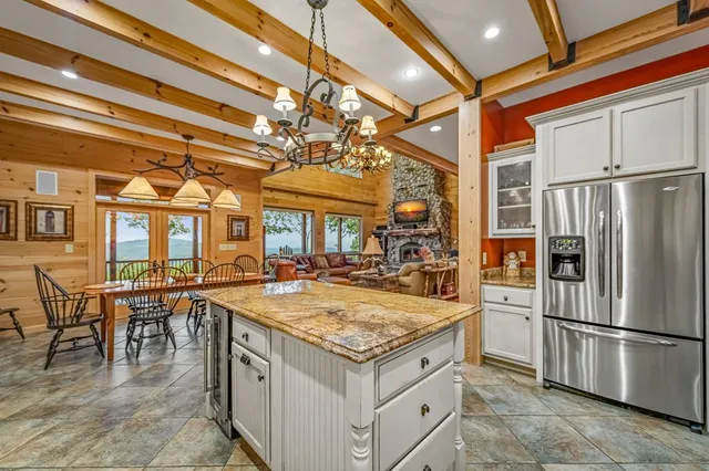 a bedroom with a large bed and a large window