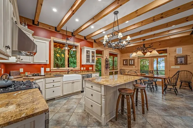 a view of a mountain with a tree in the background