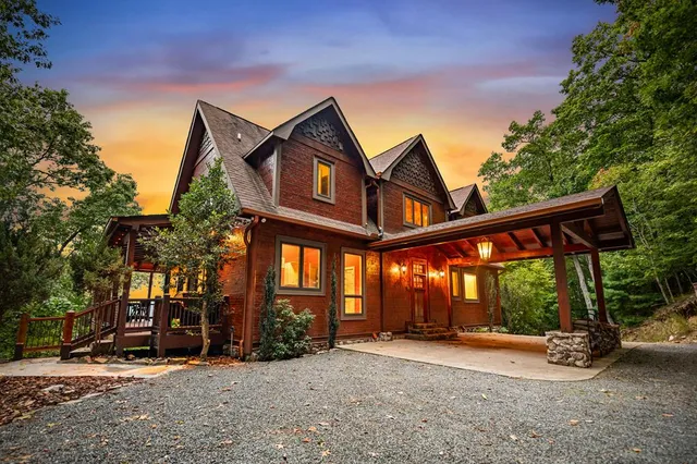 an aerial view of a house with yard swimming pool and outdoor seating