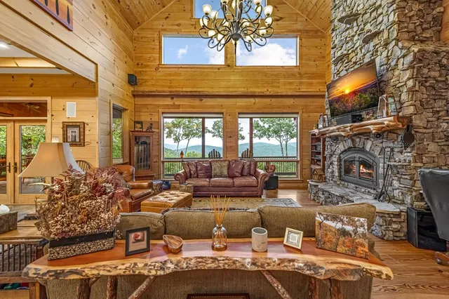 a roof deck with couch and wooden floor
