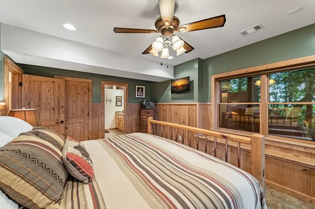 a bed room with a bed and a window