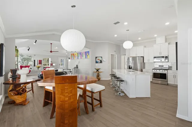a kitchen with a sink a stove and cabinets