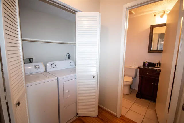 a view of a storage & utility room with two washing machine
