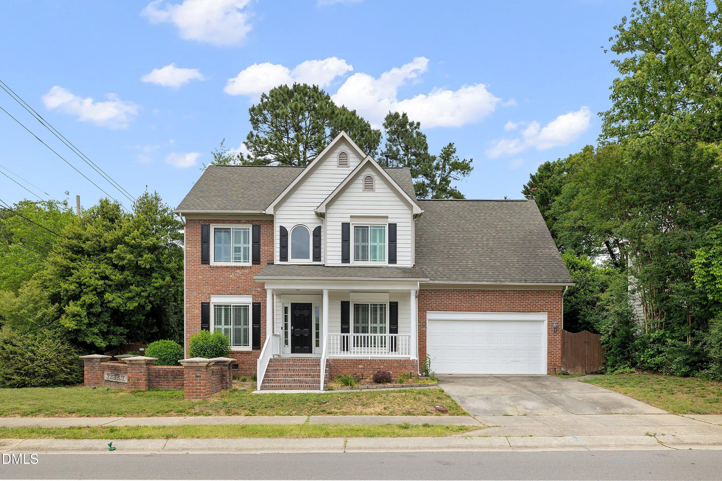 2428 Havershire Drive Raleigh, NC 27613 - Photo 2 of 53 a front view of a house with a yard