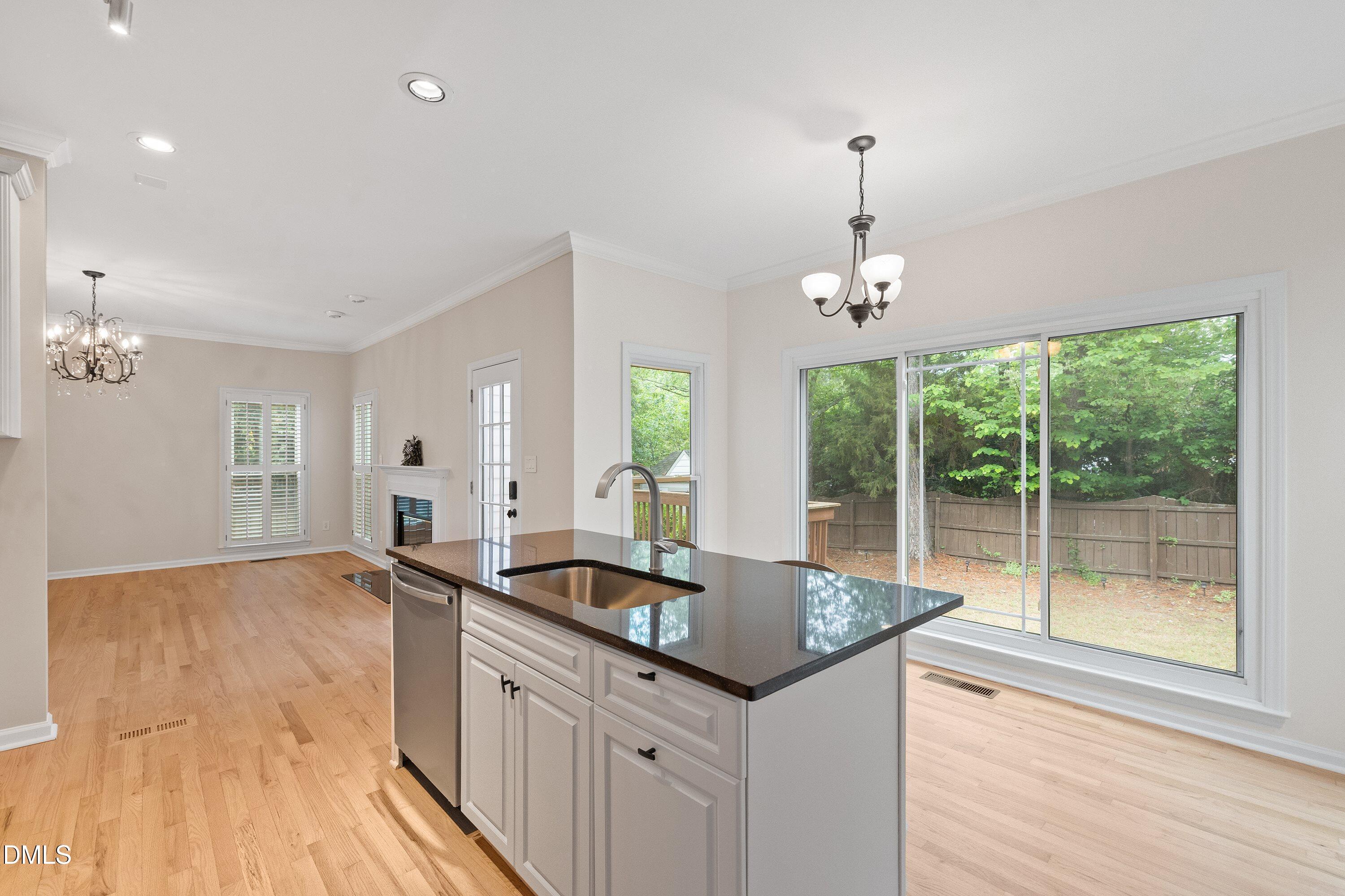 2428 Havershire Drive Raleigh, NC 27613 - Photo 22 of 53 a kitchen with a sink and large windows