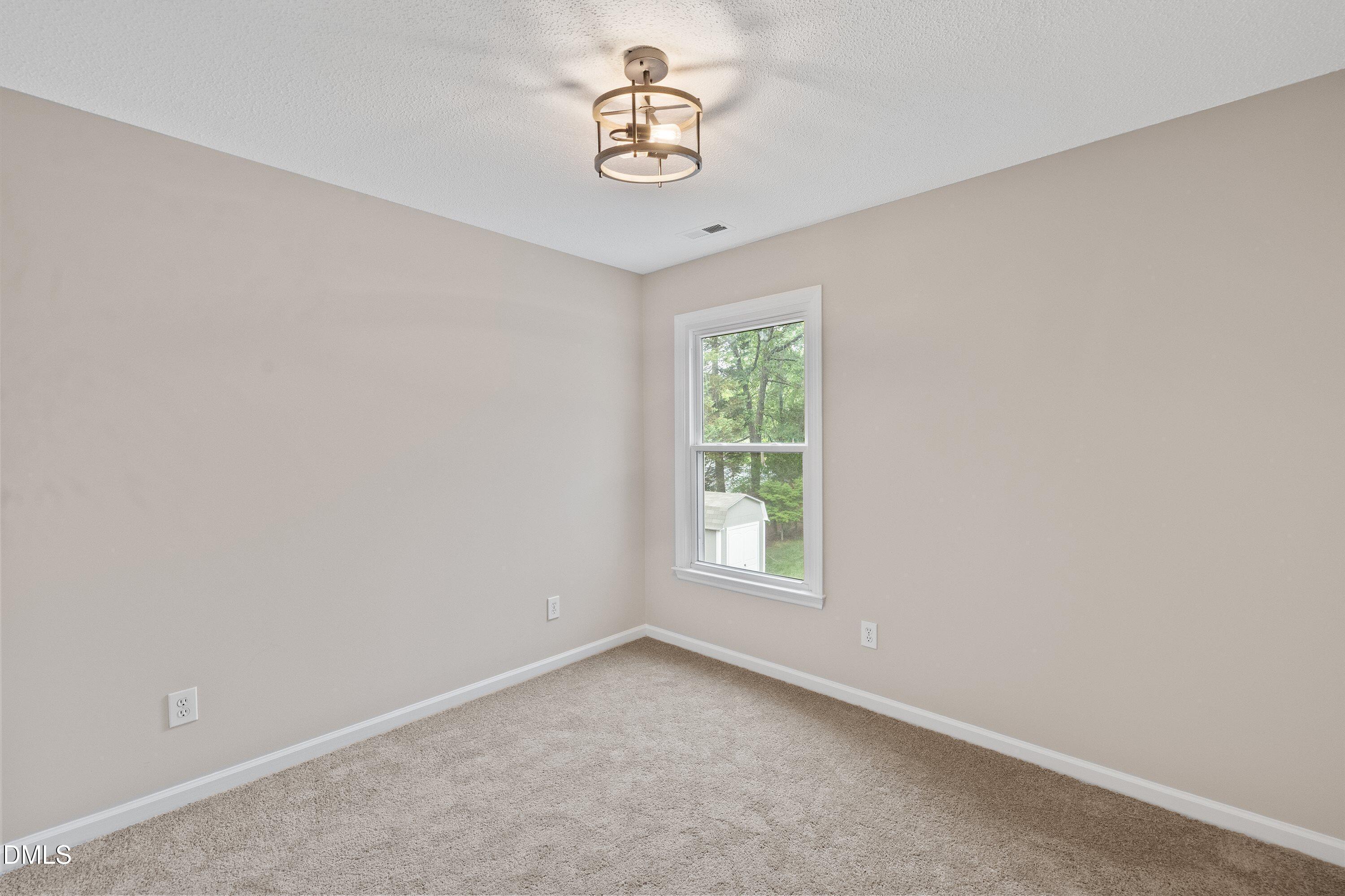 2428 Havershire Drive Raleigh, NC 27613 - Photo 37 of 53 an empty room with a window