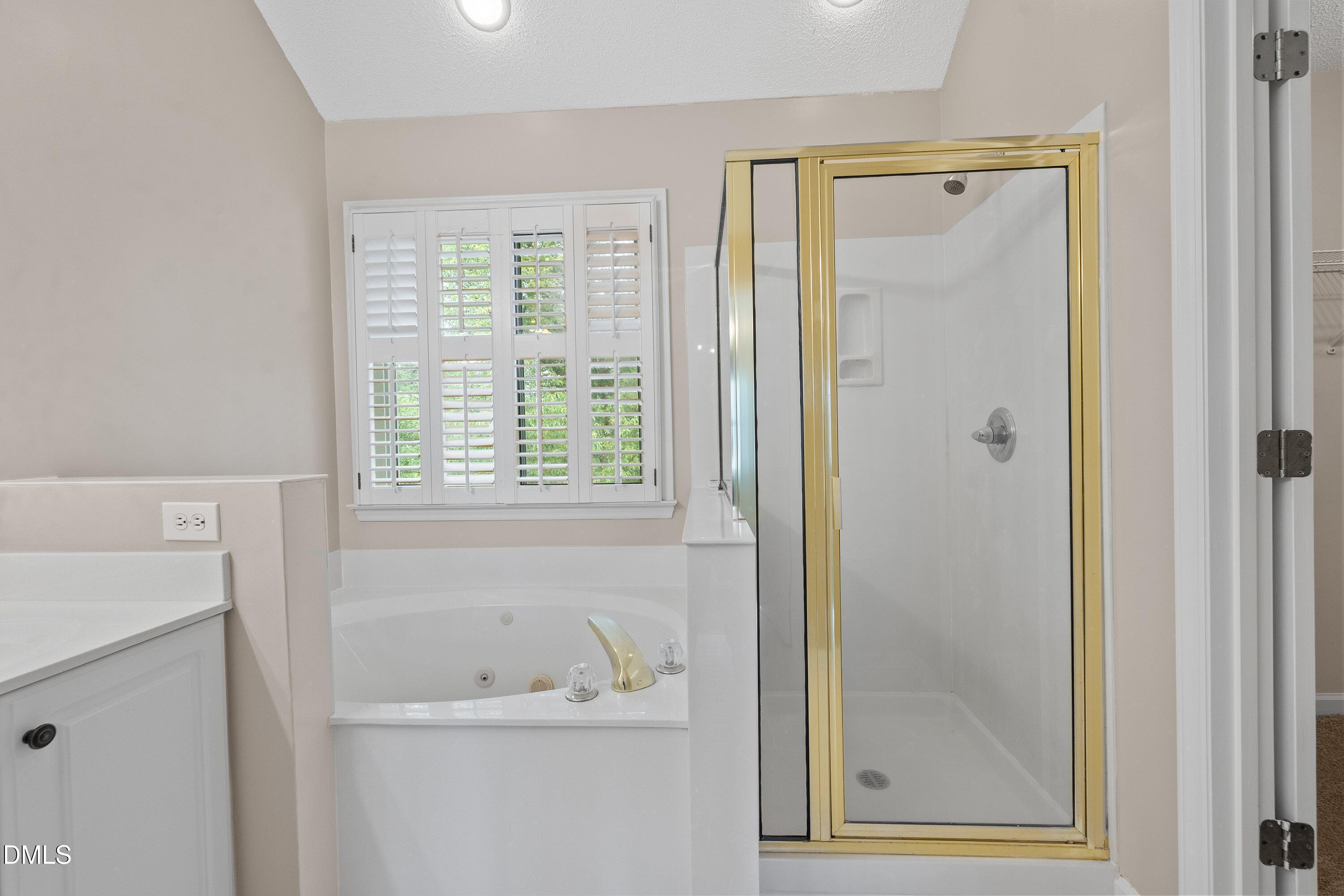 2428 Havershire Drive Raleigh, NC 27613 - Photo 44 of 53 a bathroom with a bathtub and a window