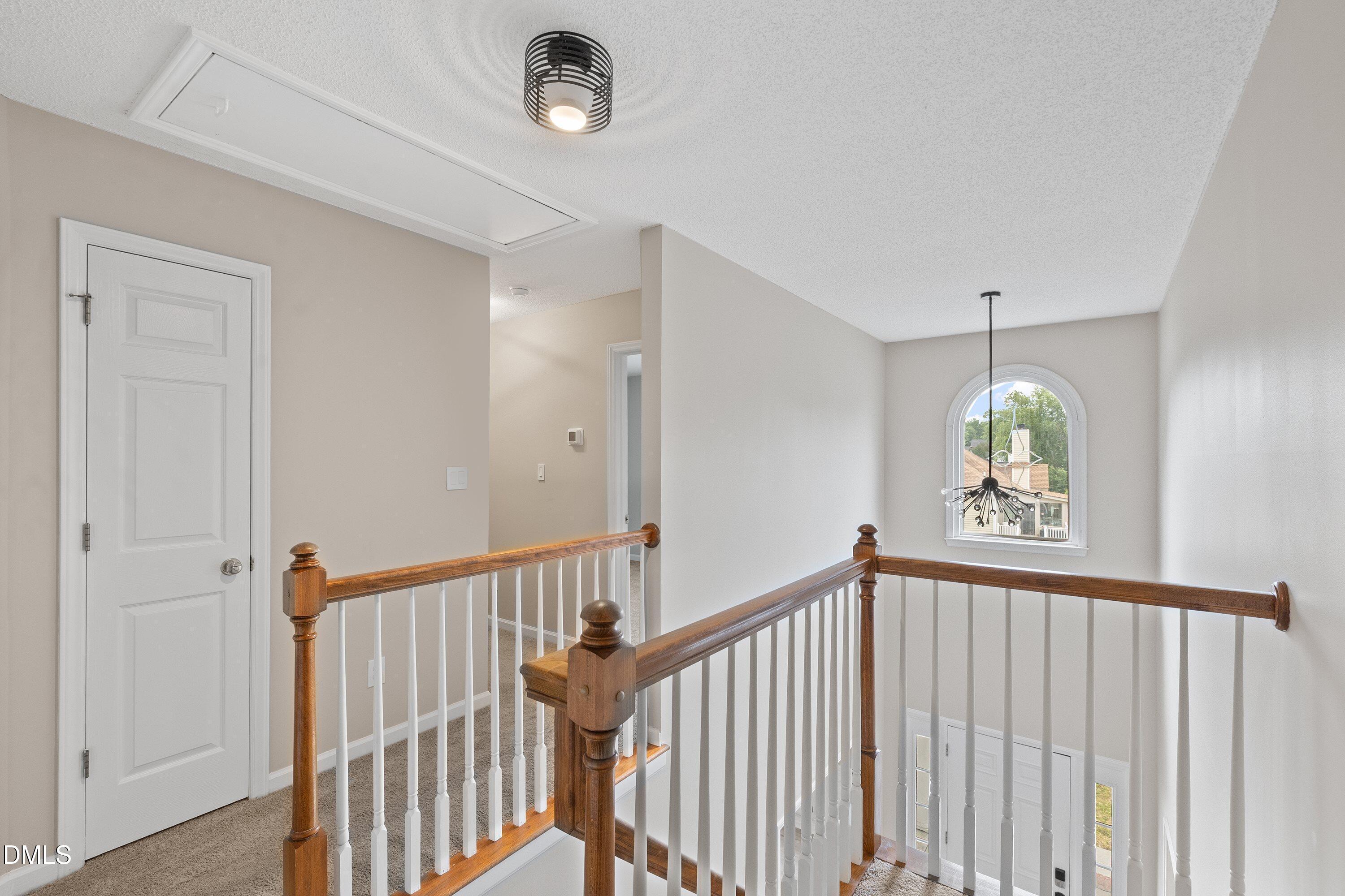 2428 Havershire Drive Raleigh, NC 27613 - Photo 47 of 53 a view of a hallway to a window