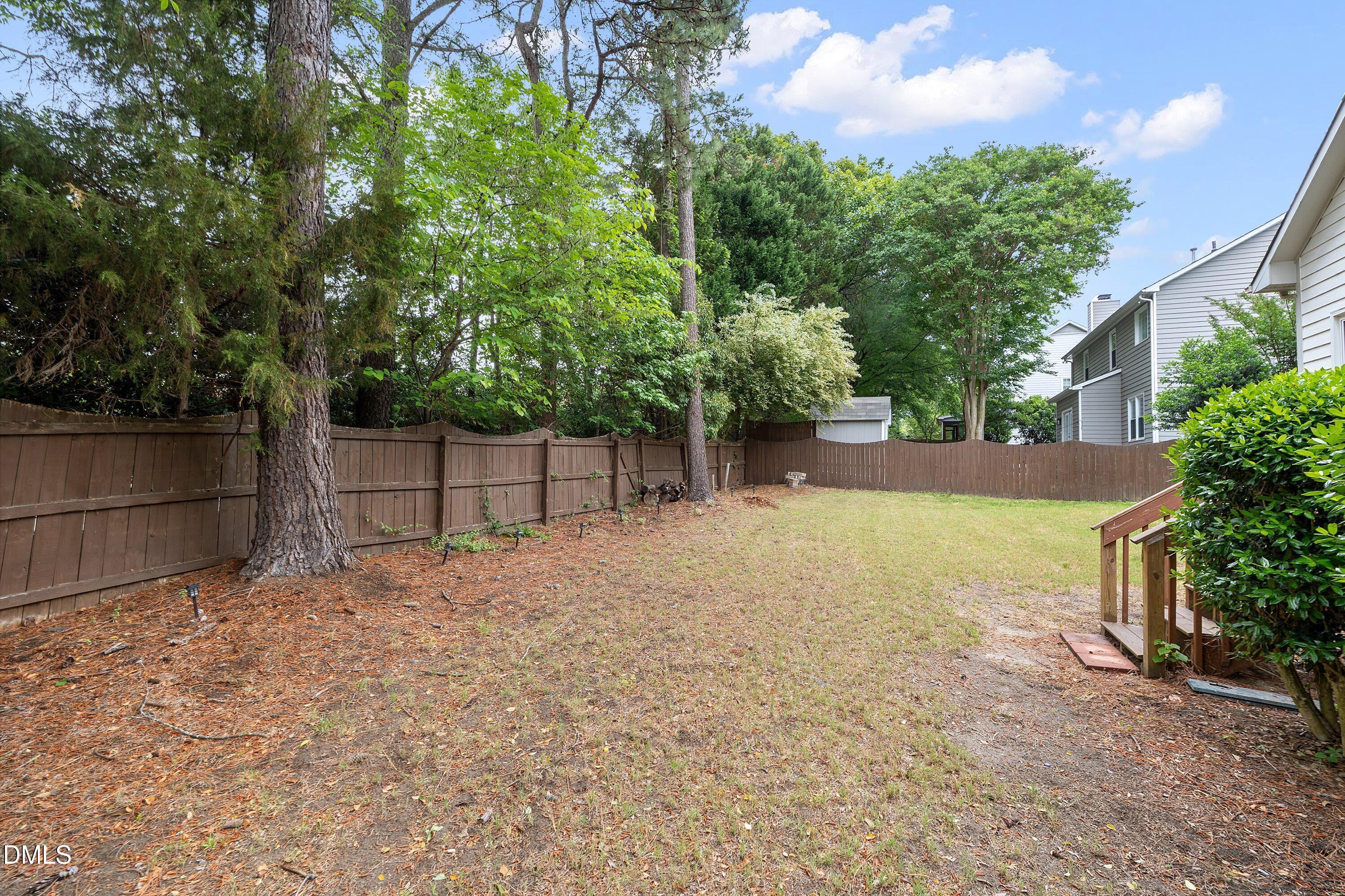 2428 Havershire Drive Raleigh, NC 27613 - Photo 53 of 53 a view of backyard and tree